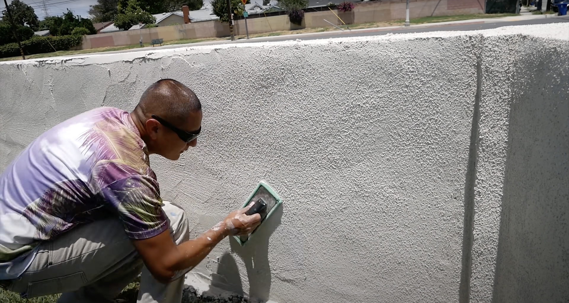 Professional concrete finishing work with specialized tools Concrete contractor applying professional finishing techniques to smooth surface