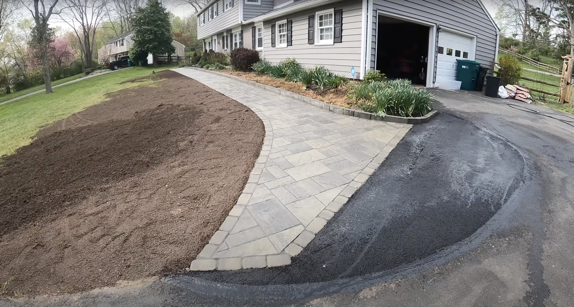 Experienced concrete installation team working on home improvement project Professional concrete contractor team completing residential project